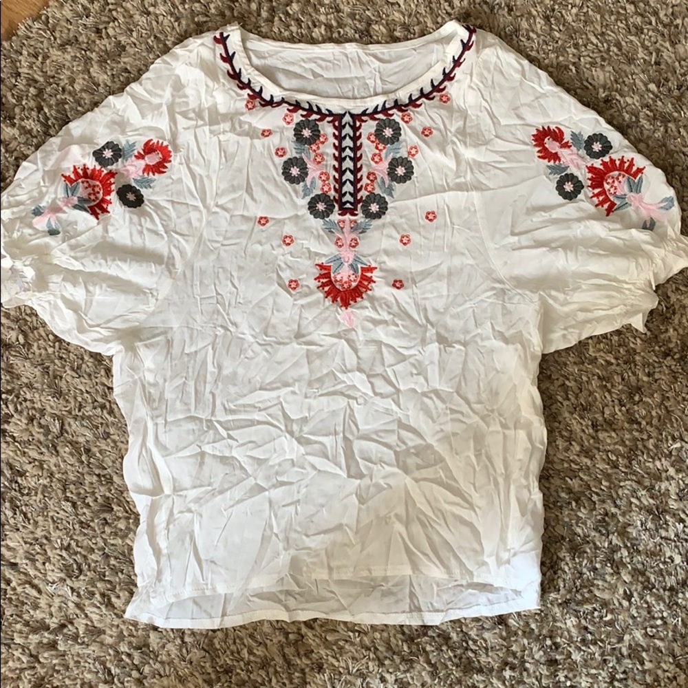 White blouse with floral embroidery